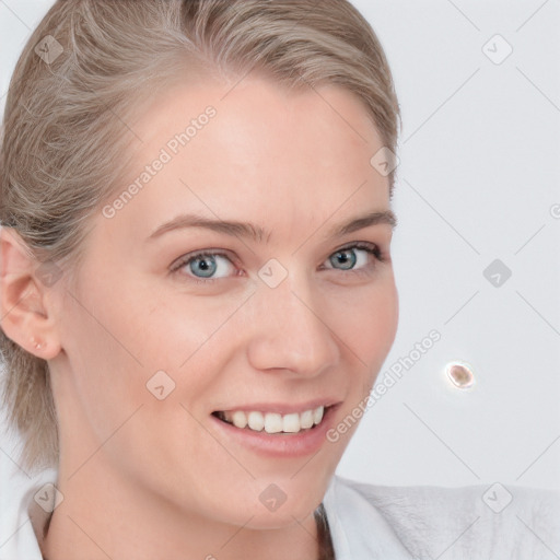 Joyful white young-adult female with medium  brown hair and blue eyes