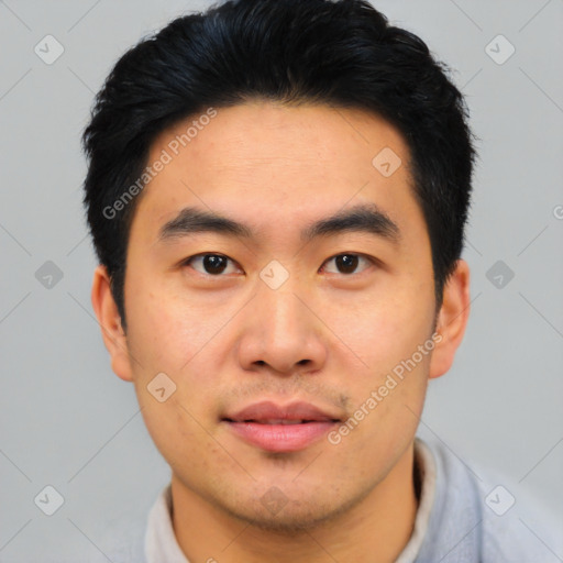 Joyful asian young-adult male with short  black hair and brown eyes