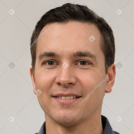 Joyful white young-adult male with short  brown hair and brown eyes