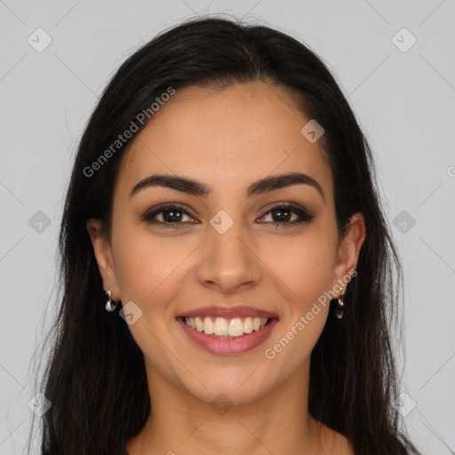 Joyful latino young-adult female with long  brown hair and brown eyes