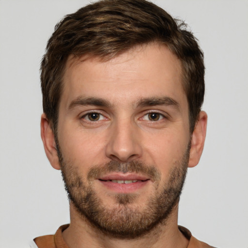 Joyful white young-adult male with short  brown hair and brown eyes