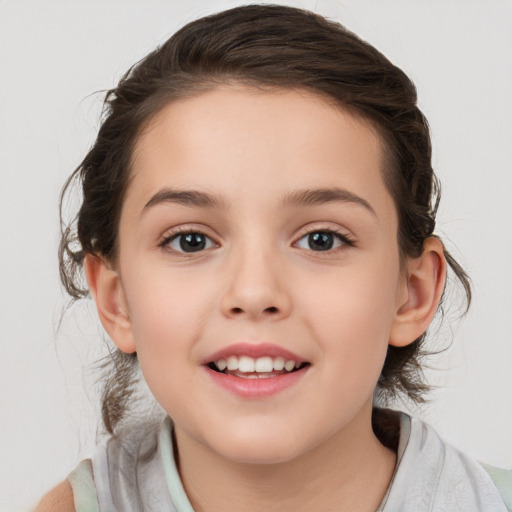 Joyful white child female with medium  brown hair and brown eyes