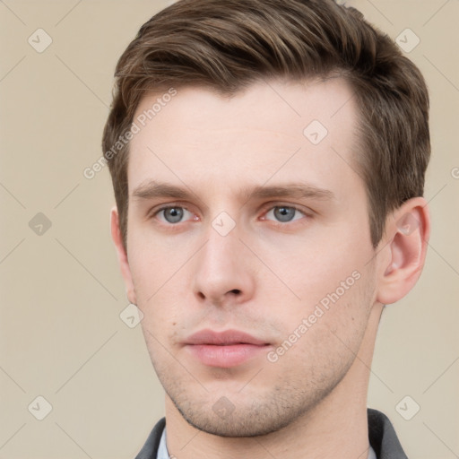 Neutral white young-adult male with short  brown hair and grey eyes