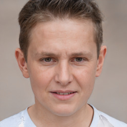 Joyful white adult male with short  brown hair and brown eyes