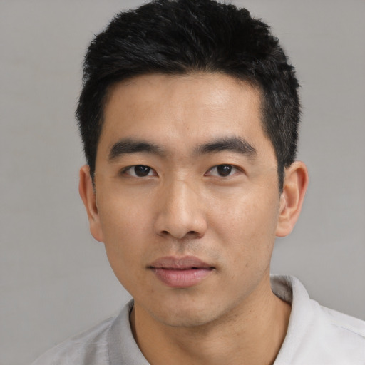 Neutral asian young-adult male with short  black hair and brown eyes