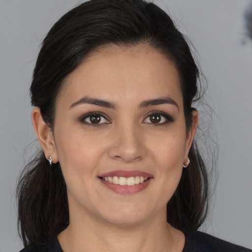 Joyful white young-adult female with medium  brown hair and brown eyes