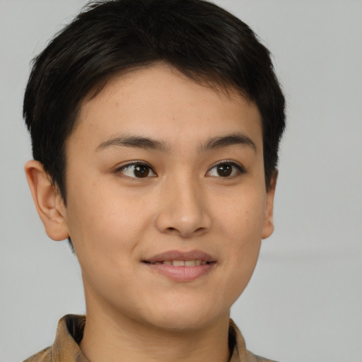 Joyful asian young-adult female with short  brown hair and brown eyes