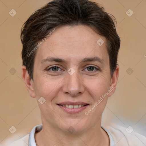 Joyful white adult female with short  brown hair and brown eyes