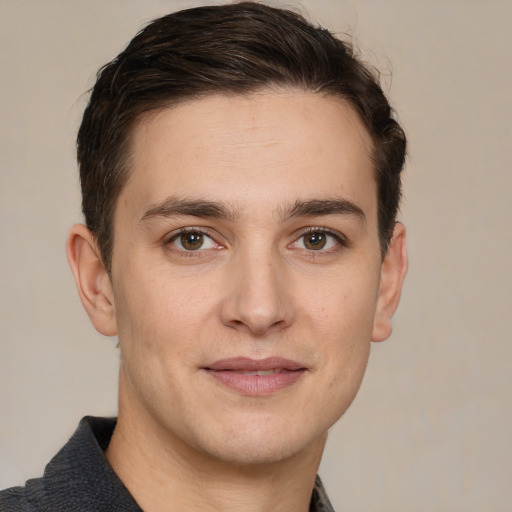 Joyful white young-adult male with short  brown hair and brown eyes