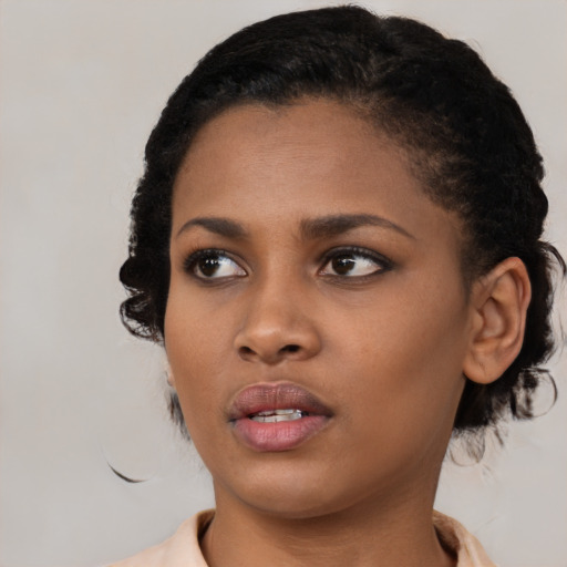 Neutral black young-adult female with short  black hair and brown eyes