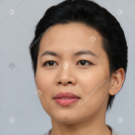 Joyful asian young-adult female with short  brown hair and brown eyes