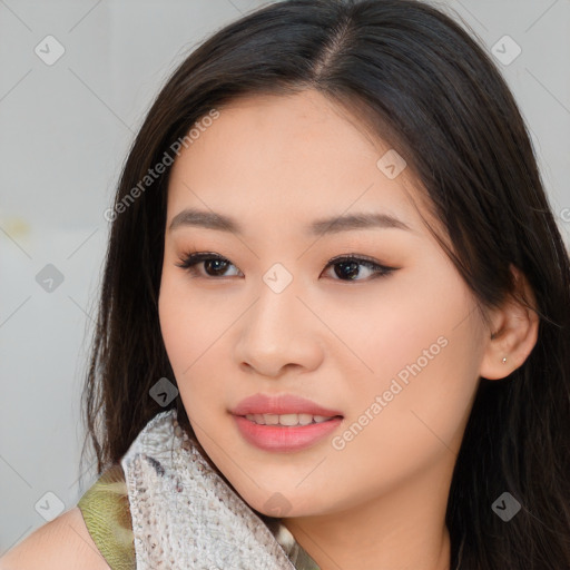 Joyful asian young-adult female with long  brown hair and brown eyes