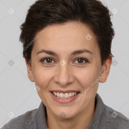 Joyful white adult female with short  brown hair and brown eyes