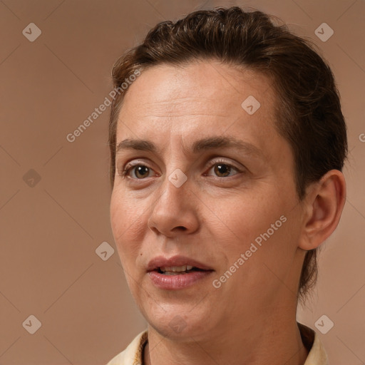 Joyful white adult female with short  brown hair and brown eyes