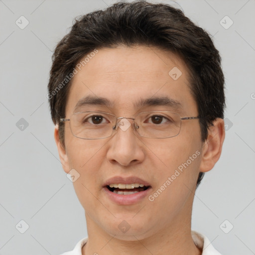 Joyful white adult male with short  brown hair and brown eyes