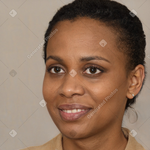 Joyful black young-adult female with medium  brown hair and brown eyes