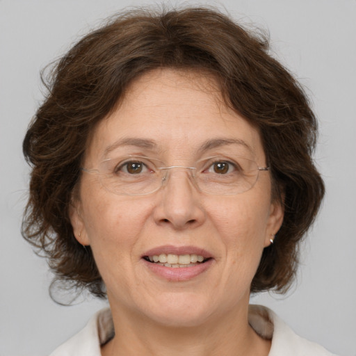 Joyful white middle-aged female with medium  brown hair and brown eyes