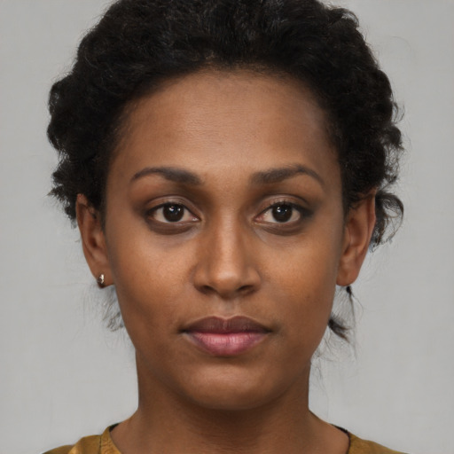 Neutral black young-adult female with short  brown hair and brown eyes