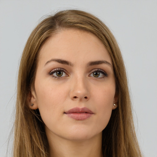 Neutral white young-adult female with long  brown hair and brown eyes