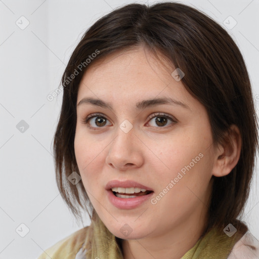 Joyful white young-adult female with medium  brown hair and brown eyes