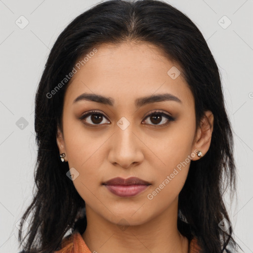 Joyful latino young-adult female with long  brown hair and brown eyes