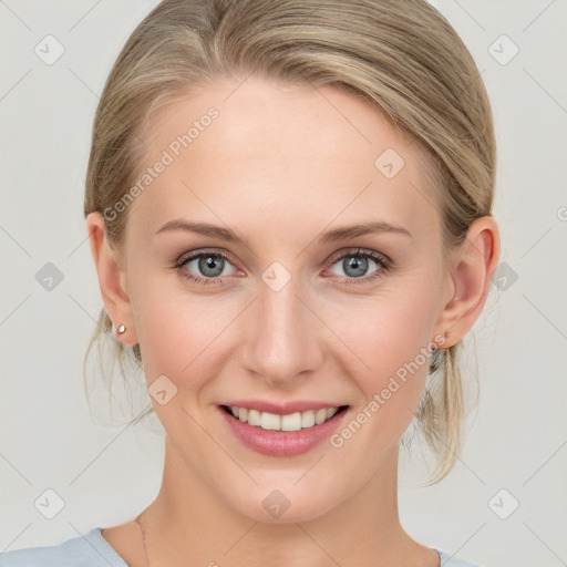 Joyful white young-adult female with medium  brown hair and blue eyes