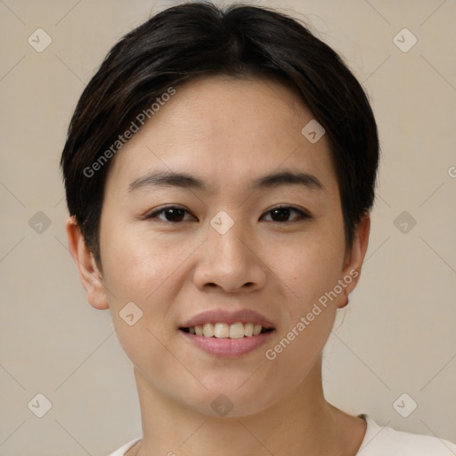 Joyful asian young-adult female with short  brown hair and brown eyes