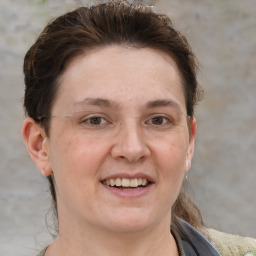 Joyful white adult female with short  brown hair and grey eyes