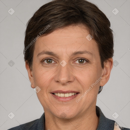 Joyful white adult female with short  brown hair and brown eyes