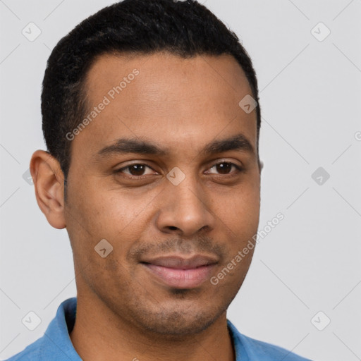 Joyful black young-adult male with short  brown hair and brown eyes