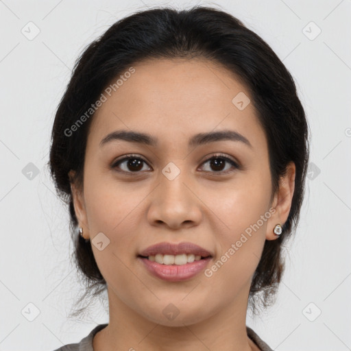 Joyful latino young-adult female with medium  brown hair and brown eyes