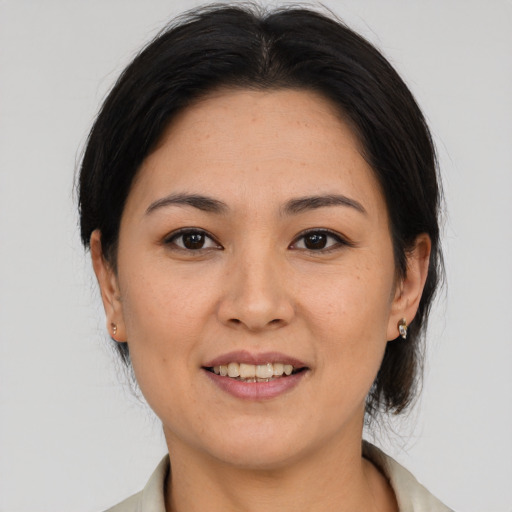 Joyful asian young-adult female with medium  brown hair and brown eyes