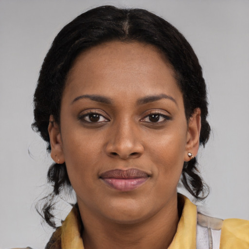 Joyful latino young-adult female with medium  black hair and brown eyes