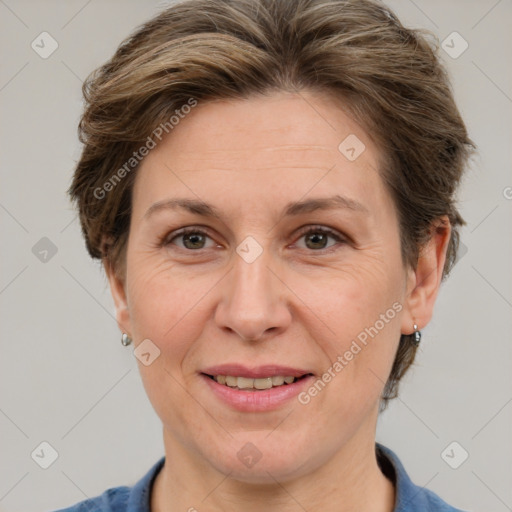 Joyful white adult female with short  brown hair and grey eyes