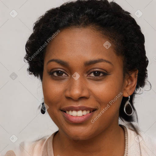 Joyful black young-adult female with long  brown hair and brown eyes