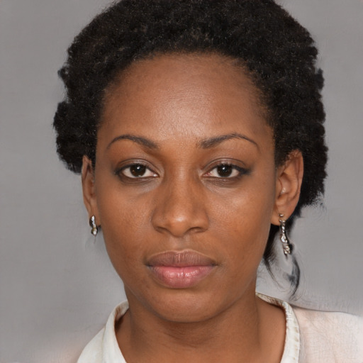 Neutral black adult female with short  black hair and brown eyes