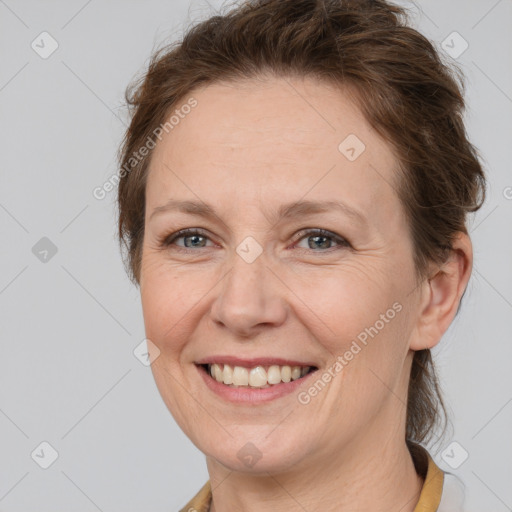 Joyful white adult female with short  brown hair and brown eyes