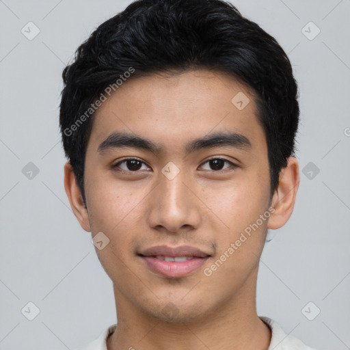 Joyful asian young-adult male with short  black hair and brown eyes