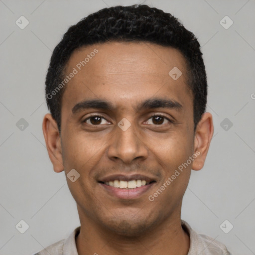 Joyful latino young-adult male with short  black hair and brown eyes