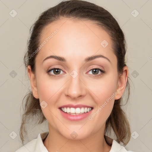 Joyful white young-adult female with medium  brown hair and green eyes