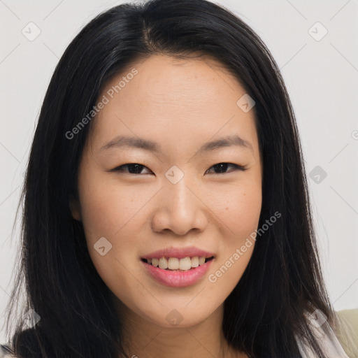 Joyful asian young-adult female with long  brown hair and brown eyes