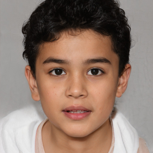 Joyful white child male with short  brown hair and brown eyes