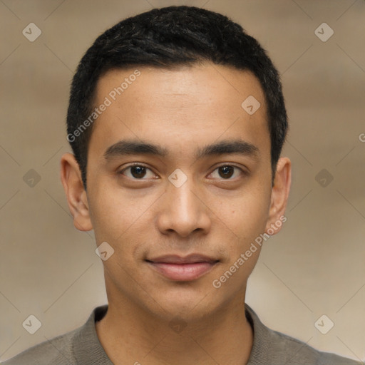 Joyful latino young-adult male with short  brown hair and brown eyes