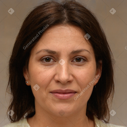 Joyful white adult female with medium  brown hair and brown eyes