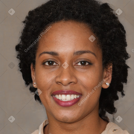 Joyful black young-adult female with medium  brown hair and brown eyes