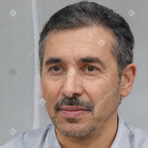 Joyful white adult male with short  black hair and brown eyes