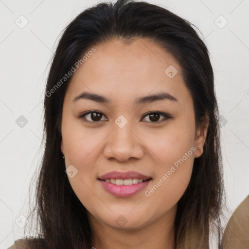 Joyful asian young-adult female with long  brown hair and brown eyes