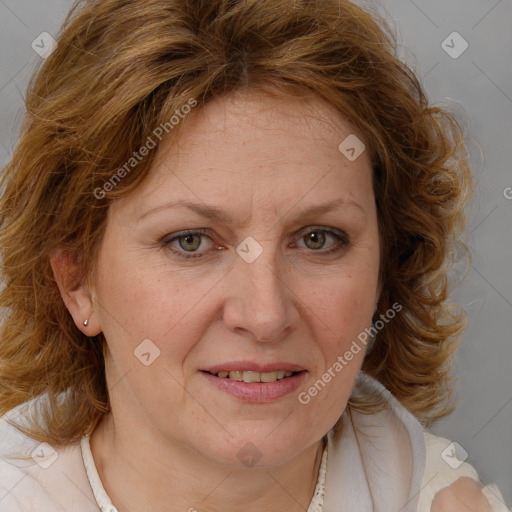 Joyful white adult female with medium  brown hair and blue eyes