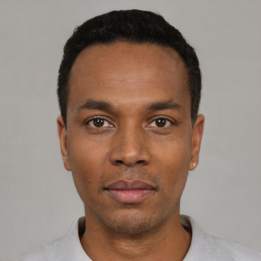 Neutral black young-adult male with short  black hair and brown eyes