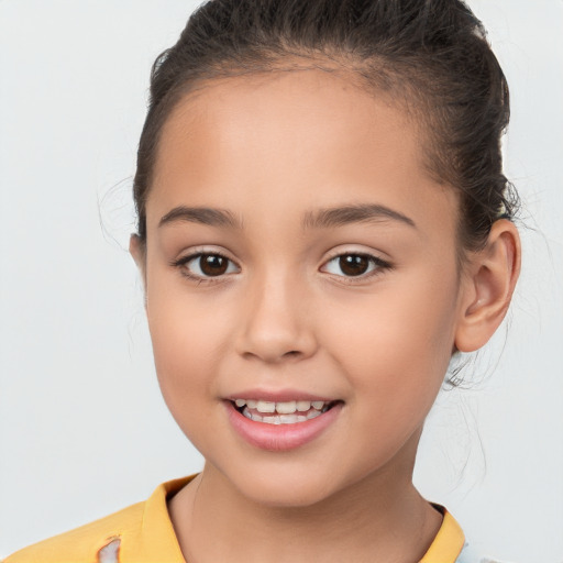 Joyful white child female with short  brown hair and brown eyes